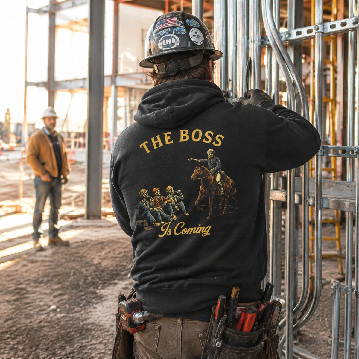 Electrician wearing The Boss Is Coming hoodie