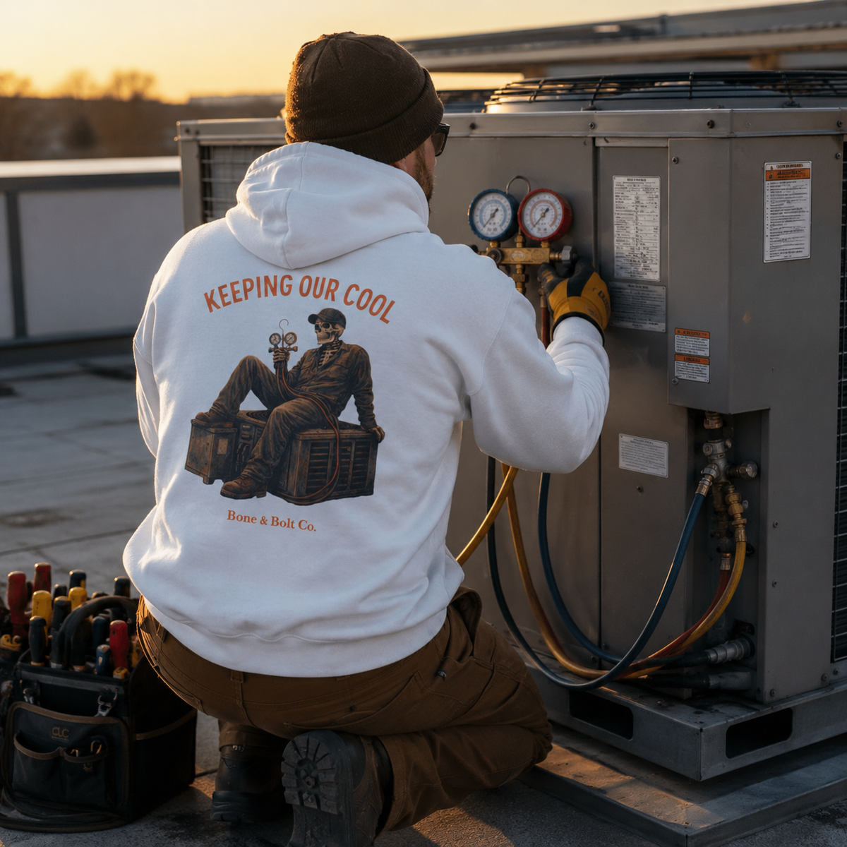 HVAC technician wearing Keeping Our Cool hoodie